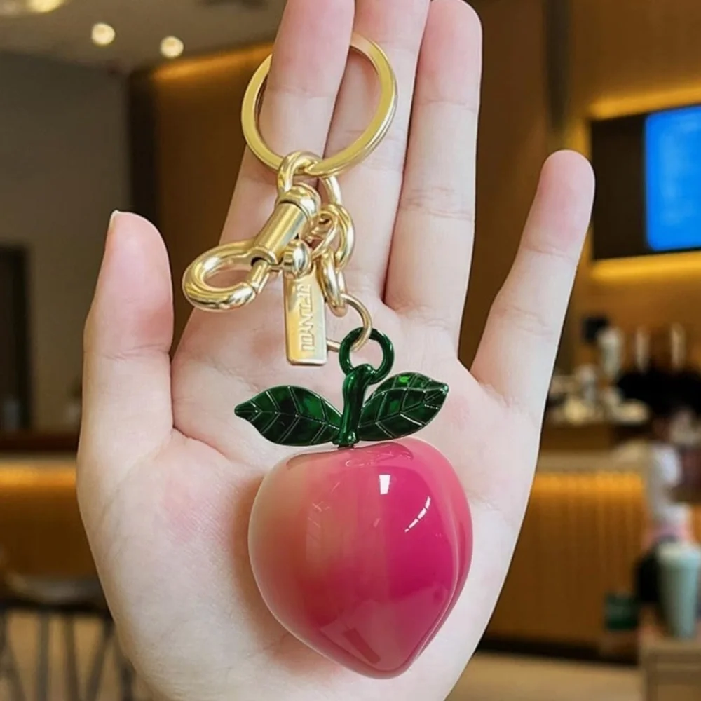 Peach purse bag charm clip Keychain, Green Leaves, gold hardware